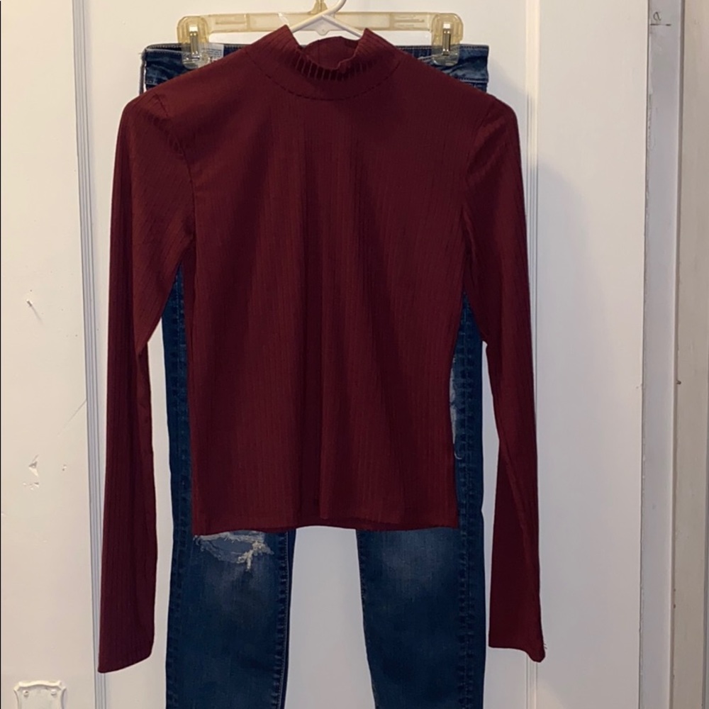Long sleeve maroon shirt.